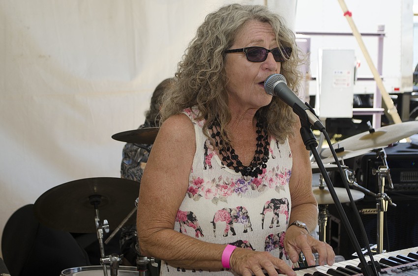 Members of Kat Crosby Band perform at Wine on the Water on April 9 on the grounds of Van Wezel Performing Arts Hall.