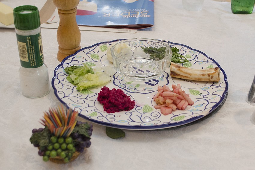 The seder plate — this one found on the table during the Passover seder at the Straff Passover Party on April 10 at the home of Roberta and Larry Straff — consists of several symbolic items, many of which represent the struggle of slavery.