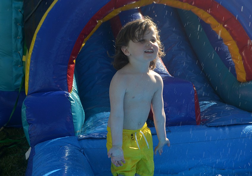 Mac Albring, 3, splashes his dad with water at Sand Cay on April 14.