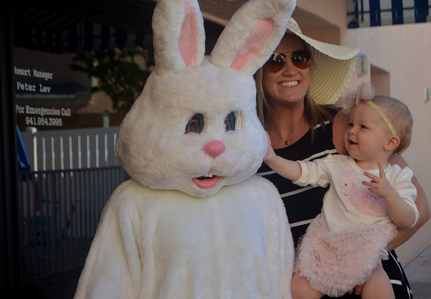 Samantha Simmons, 14 months, is all smiles as she meets the Easter Bunny.