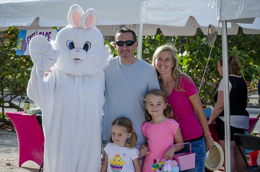Bill, Michelle, Sami and Alex Brainsfield pose with the Easter bunny at the Siesta Key Easter Egg Hunt.