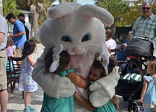 Mila and Mora Muise hug the Easter Bunny at Mar Vista on April 15. They were just two of many kids who searched for 2,300 eggs.