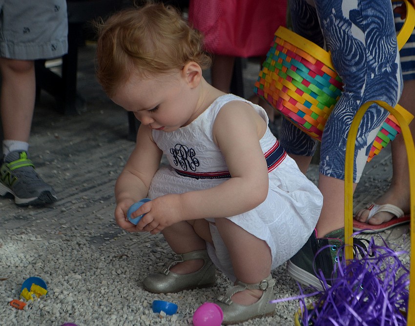 Kate Ross picks up Easter eggs at Mar Vista on April 15.