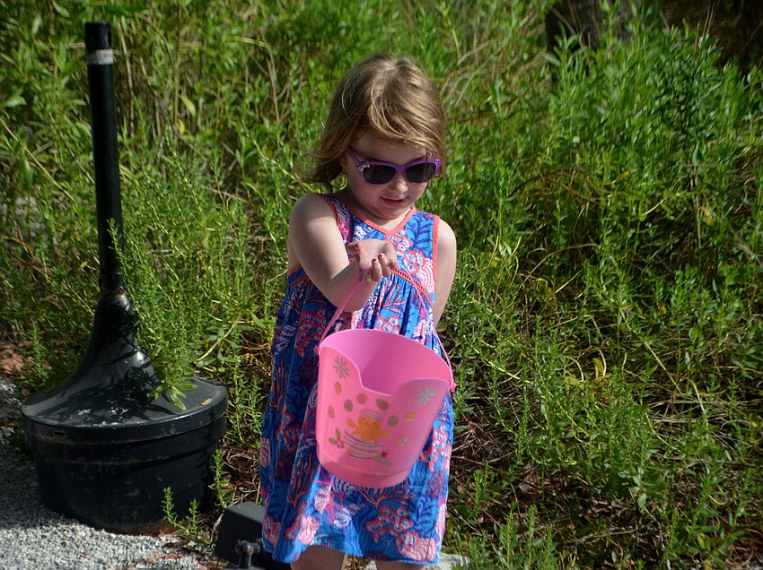 Virginia Fix shows off her Easter basket at the Mar Vista egg hunt.