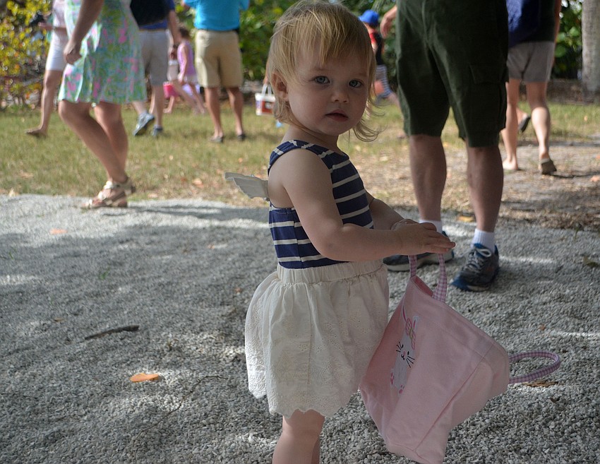 Avery Jane McDonald shows off her bag full of eggs and candy at Mar Vista on April 15.