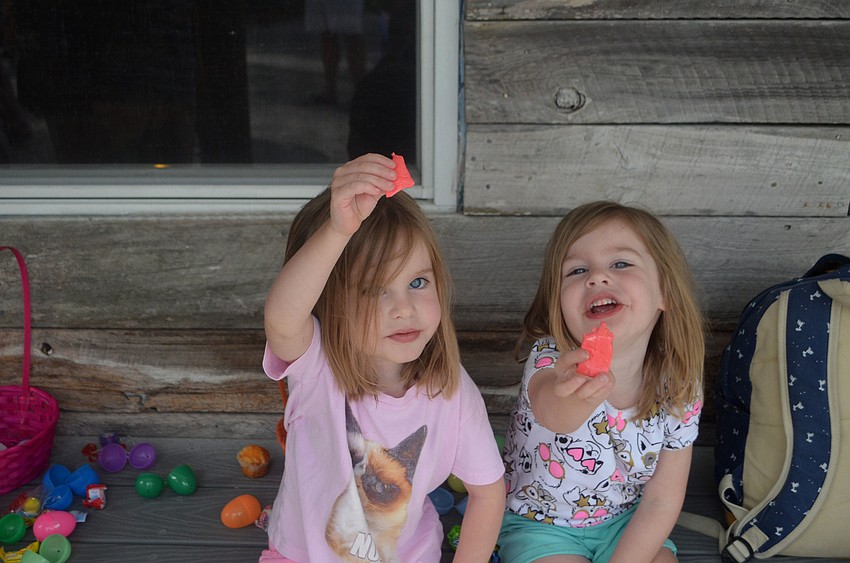 Fiona and Violet Polaski show off the candy they found during Mar Vista’s Easter egg hunt.