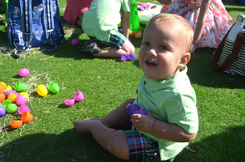 Nolan Ruiz, 10 months, is all smiles while he plays with some Easter eggs.