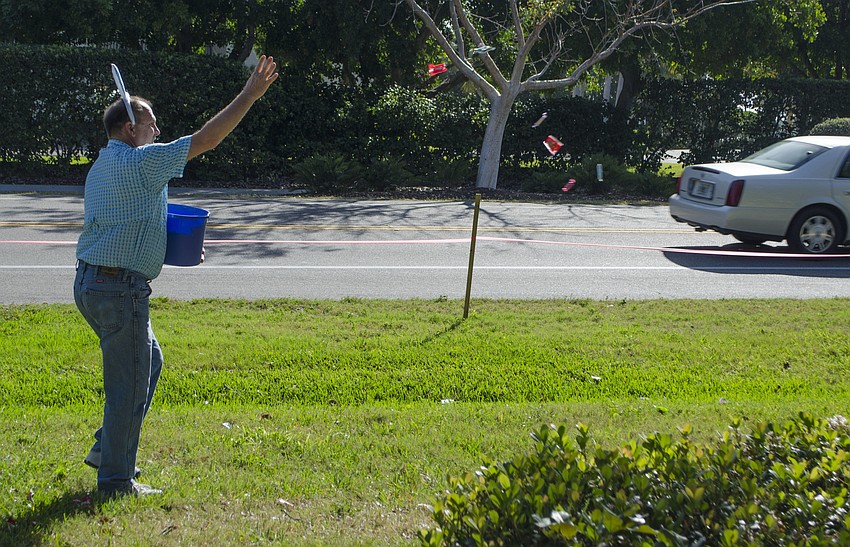 Mark Meador scatters candy on April 16 at Casa Del Mar Beach Resort.
