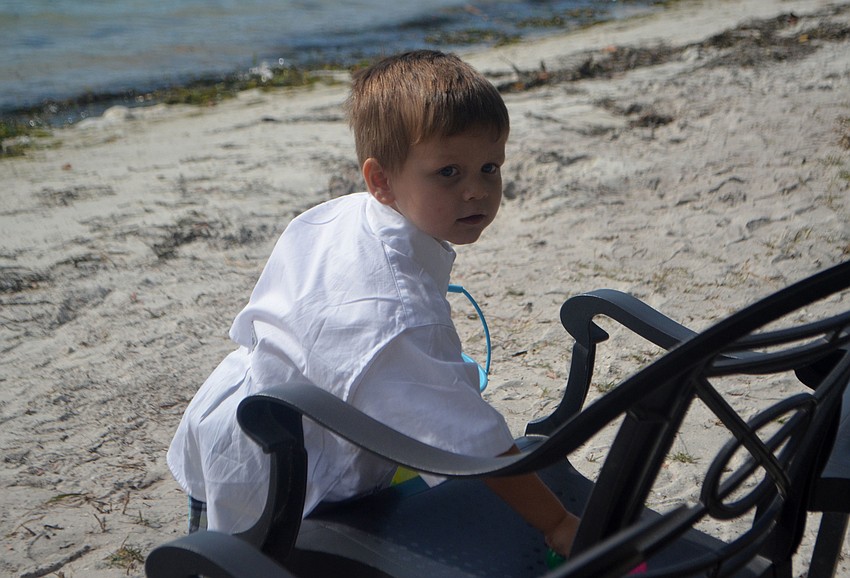 Mason Taylor finds Easter eggs along the shore.