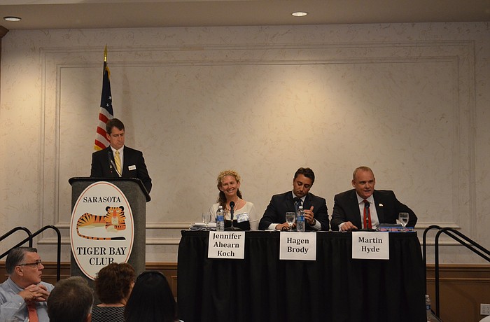 Jen Ahearn-Koch, Hagen Brody and Martin Hyde sit on the dais for a candidate forum at Monday'   s Tiger Bay meeting.