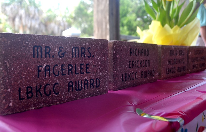 Bricks were given to those who received beautification awards from the Longboat Key Garden Club. The recipients were  Rosewitha and Manfred Helmerking, Victoria and David Fagerlee, Richard Erickson and the Longboat Island Chapel’s friendship garden.