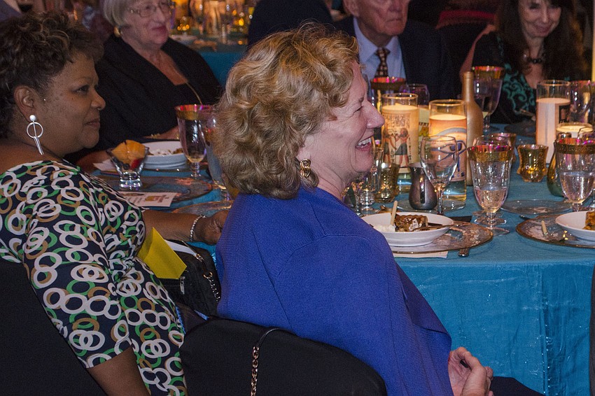 Deb Coleman laughs as Tom Honsa roasts Renee Hamad at the Sertoma Sarasota Celebrity Roast on April 18 at Michael’s On East.
