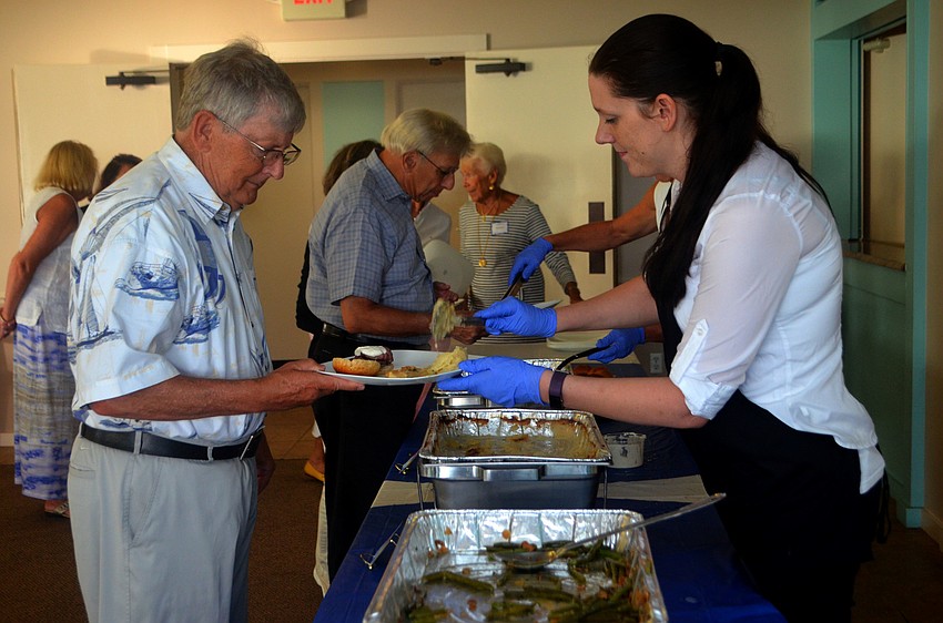 Seaplace residents enjoyed beef tenderloin, snapper,  green beans and au gratin potatoes from Alpine Steakhouse.