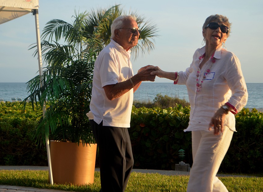 John Ellis twirls Sonja Ellis around the dance floor during Seaplace’s farewell to snowbirds party.