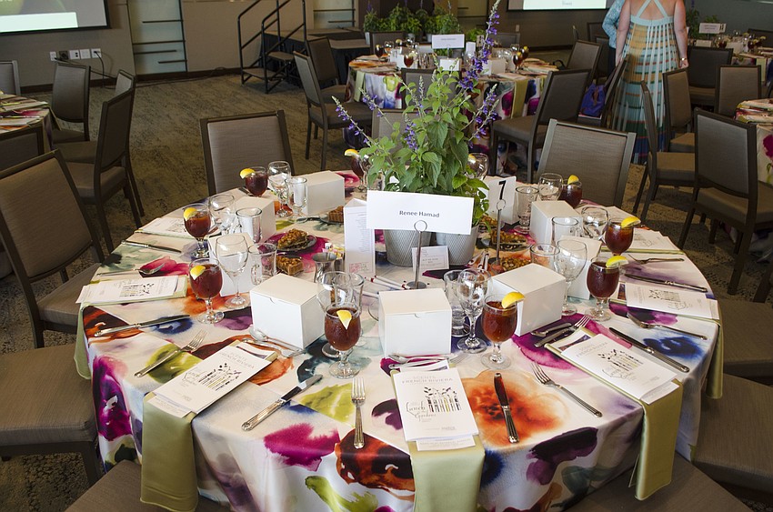 Organizers adorned every table with vibrant watercolor-print tablecloths and floral centerpieces at Lunch in the Gardens: “Scents of the French Riviera” on April 19 at Michael’s on the Bay at Selby Gardens.