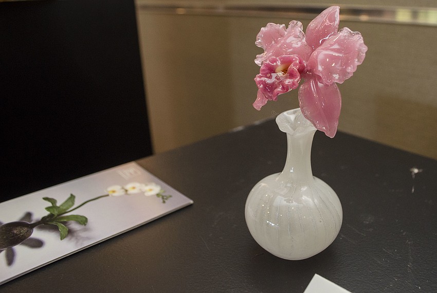 Artist Margaret Neher of 530 Burns Gallery created several glass orchid-shaped perfume bottles that were for sale at Lunch in the Gardens: “Scents of the French Riviera” on April 19 at Michael’s on the Bay at Selby Gardens.