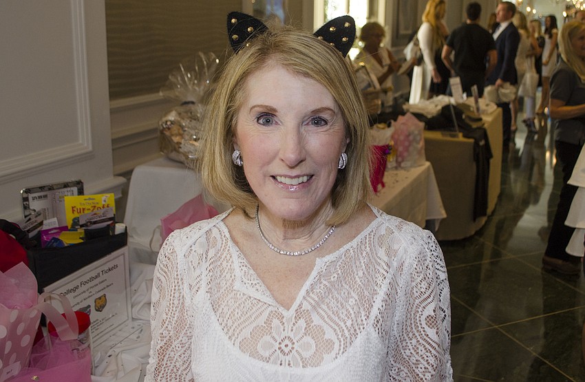 Lois Lucek shows off her festive cat ears headband at Paws on the Catwalk on April 20 at The Ritz-Carlton, Sarasota.