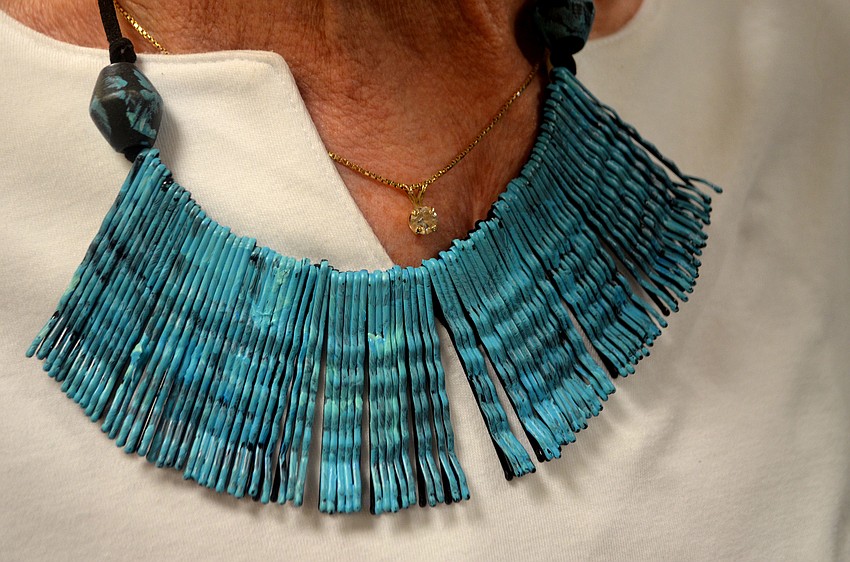 Fran Nikolich made this necklace out of old bobby pins and modeled it around the Earth Day event.