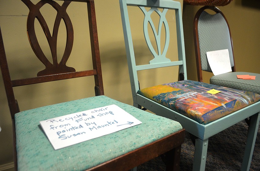 A recycled chair painted by Susan Mauntel was on display during the Earth Day event.