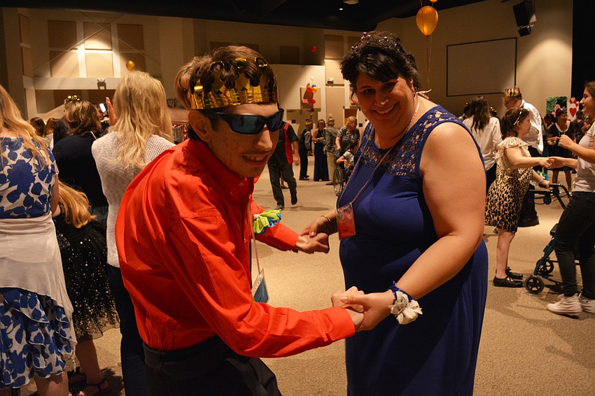 Joshua Bragg dances with his mom, Shelley Bragg.