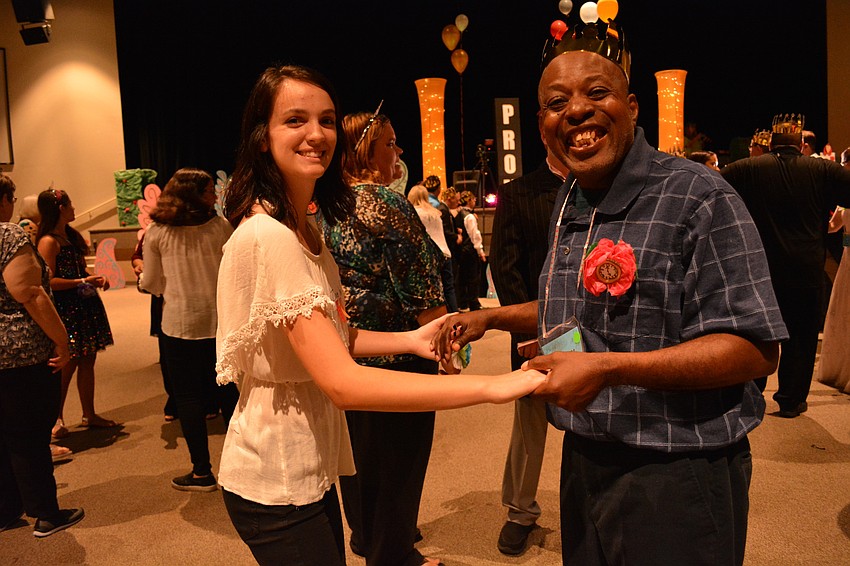 Braden River High'     s Zoie Wedekind dances with Harry Yawn.