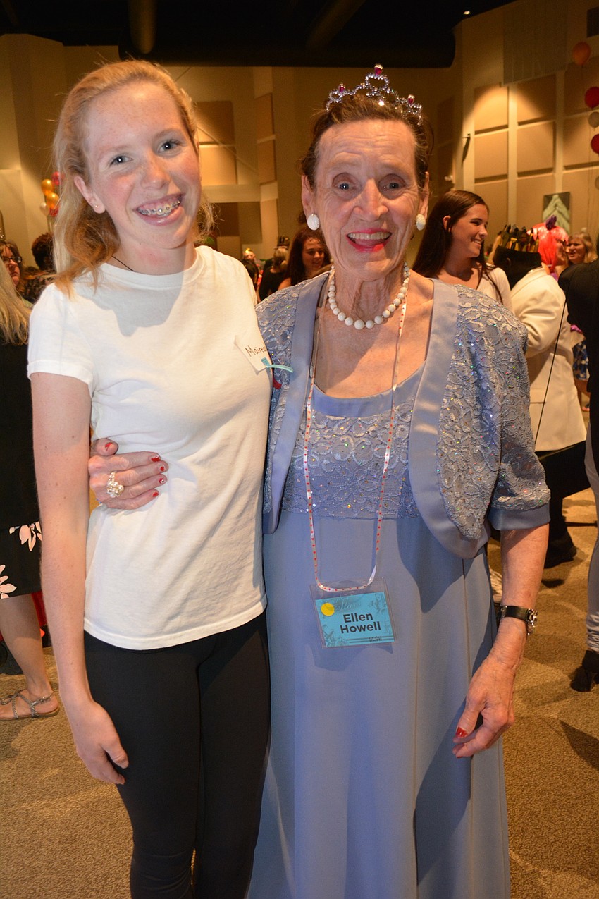 The Out-of-Door Academy sophomore Mairead Studdiford dances with attendee Ellen Howell.