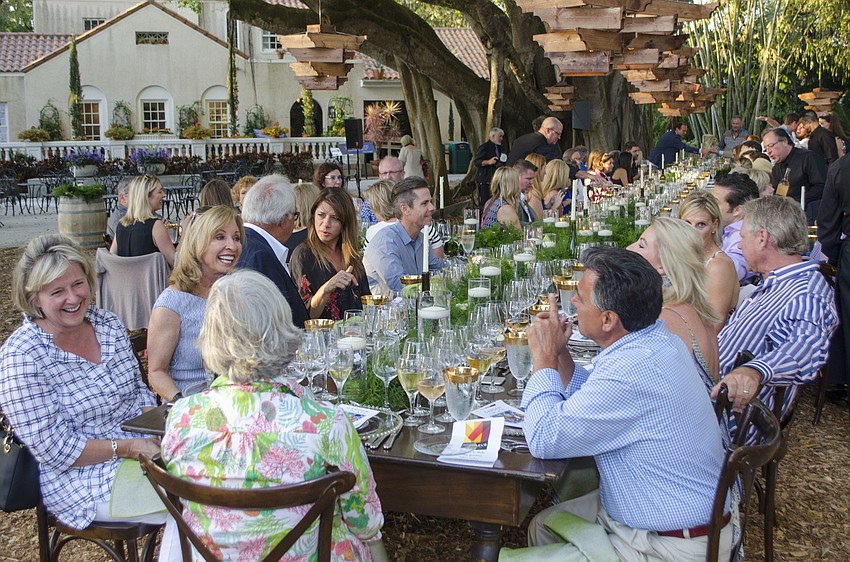 Guests sat at one continuous table for Garden to Plate: An Evening in Chagall’s French Riviera on April 21 at Marie Selby Botanical Gardens.