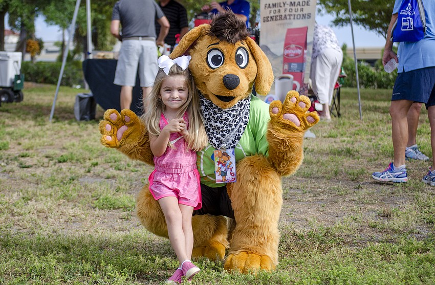 Annabelle Taplinger poses with Tod Puppy.
