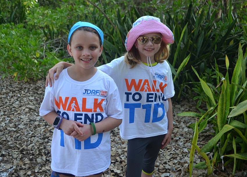 Olive Imerman and Addy Hartley pose before they begin the JDRF walk. Imerman was recently diagnosed with Type 1 Diabetes and shared some facts about her day-to-day life with participants.