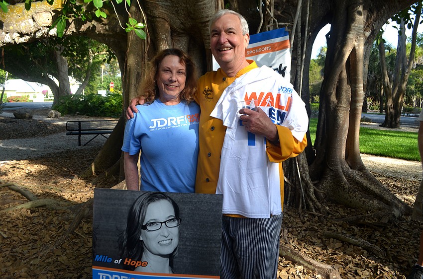 D’Arcy and Ray Arpkle stand with a poster of their daughter Kate, who was diagnosed with Type 1 Diabetes in 2001.