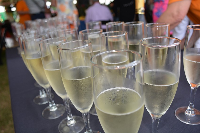 Guests carried their Champagne to their tables, a silent auction or to mingle with other guests.