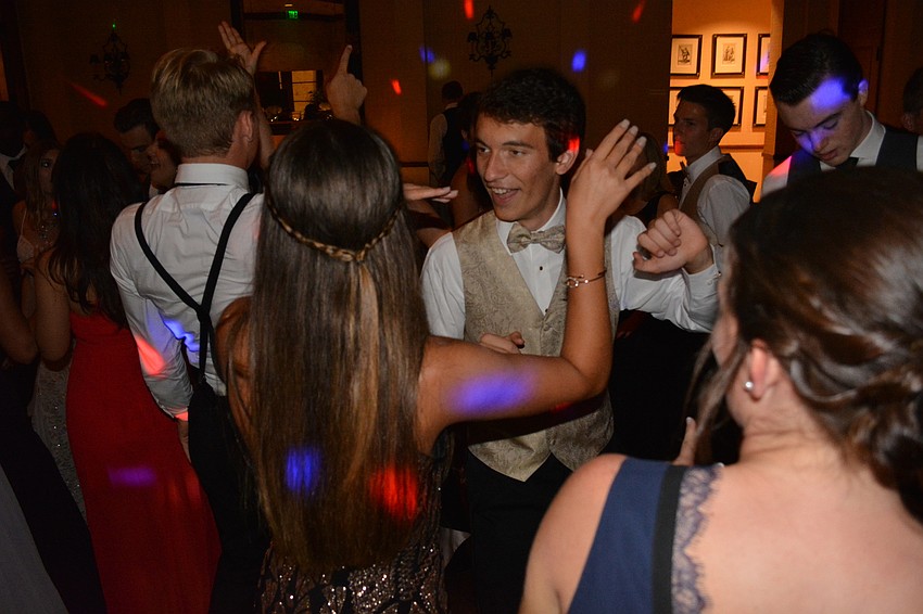 Chris Eckart draws attention from friends with his dancing.