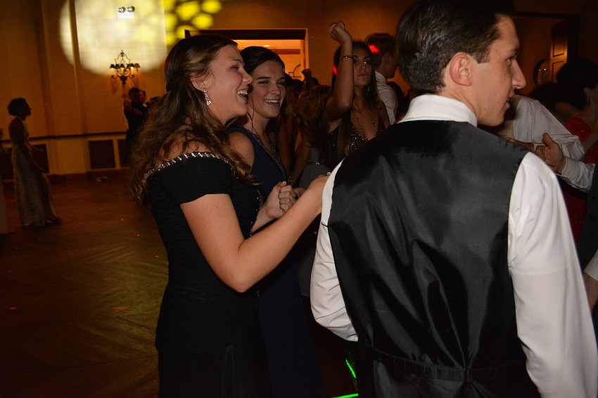 Courtney Hamilton watches her friend Chris Eckart dance.
