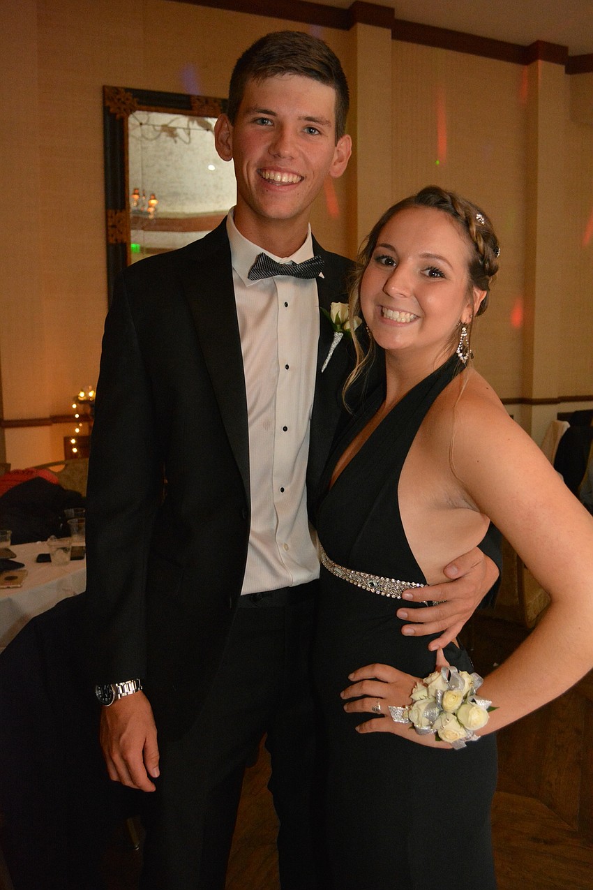 Laszlo Tengerdy, a senior, brings sophomore Alex Bridges.