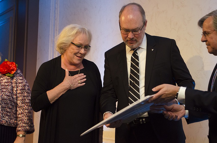 Co-Chairs Sherry and Tom Koski are awarded a print of a David Burnett photograph as a thank-you gift for planning the April 22 Greenfield Prize Dinner at Michael’s On East.