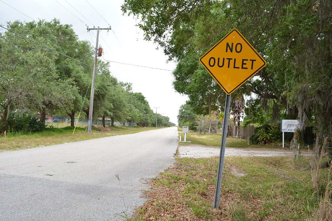 A "no outlet" sign shows that Lena Road heading south on its northern segment does not connect to the southern portion of the roadway.