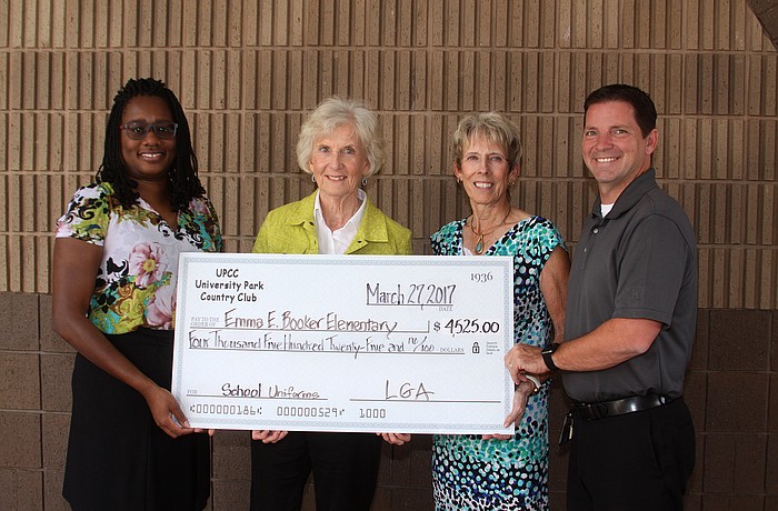 Booker Elementary Principal Â Dawn Clayton, University Park Country Club Ladies Golf Association representativesÂ Ann Nellis and Elaine Kulbako and Booker Elementary Assistant Principal Troy Thompson gather for a check presentation.