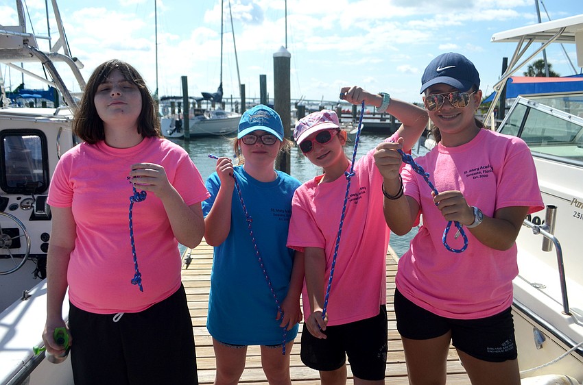 Churchill Fellman, Caroline Shoemaker, Emily Lanzarotto and Ali Kaiser show off knots they tied.