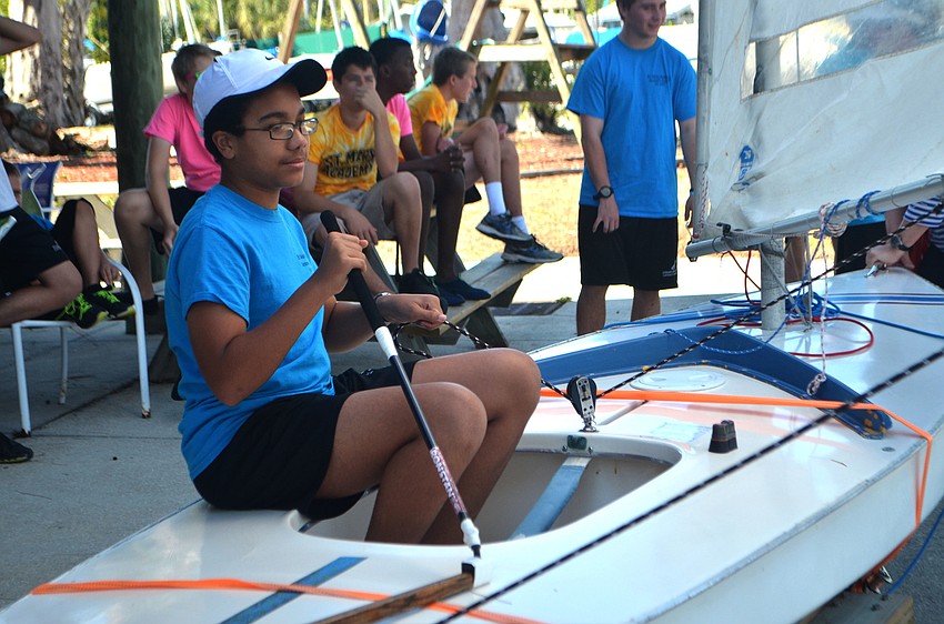 Seventh grader Sebastian Katra practices his sailing skills on the Sunfish simulator.