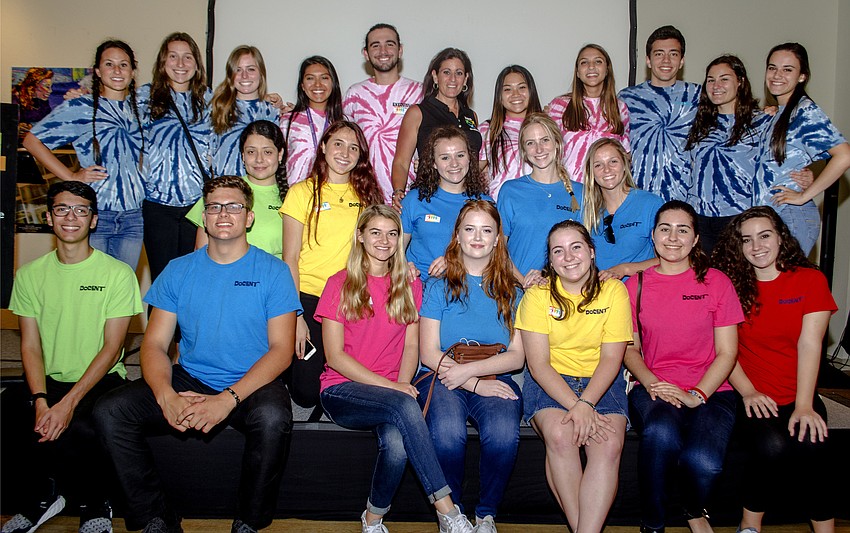 Riverview High Students pose with Advisor to the Coexistence Club Dena Sturm (top center). The students provide tours through the Embracing Our Differences Art Exhibit.