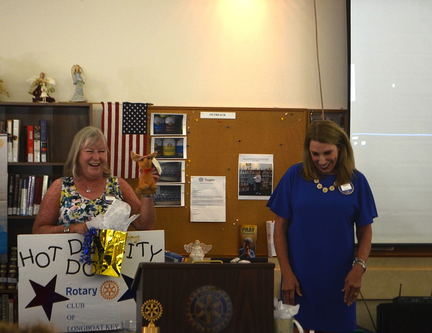 Nancy Rozance gave Carol Erker a stuffed dog to thank her for her time on organizing the “Hot Diggity Dog Parade” that is held in conjunction with Freedom Fest.