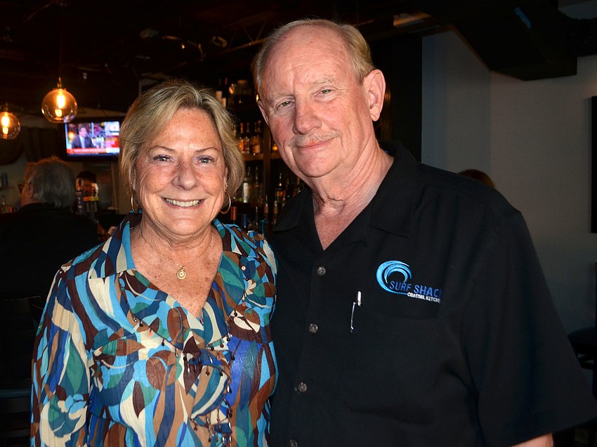 Longboat Key Chamber of Commerce President Gail Loefgren and Ron Fuller of event host Surf Shack