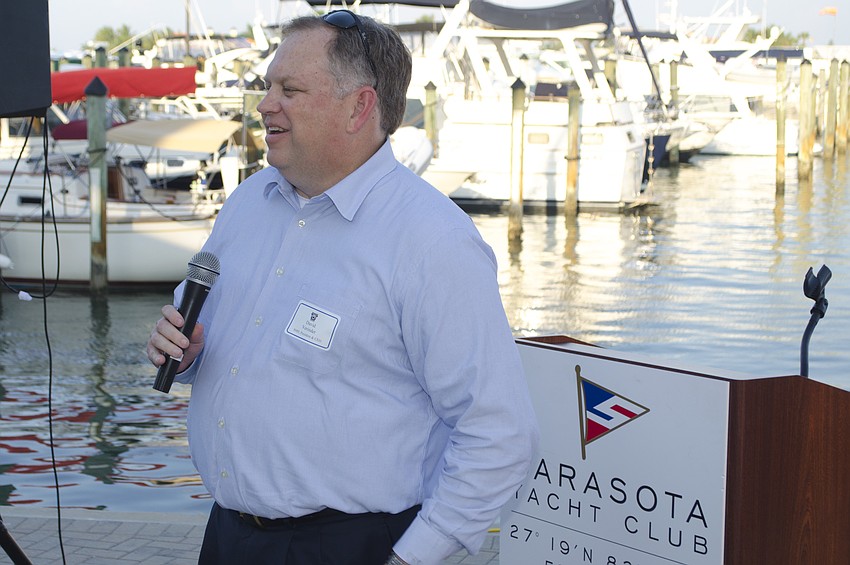 Sarasota Memorial Healthcare System President and CEO David Verinder laughs while addressing the crowd at the pre-tournament reception on April 27 at Sarasota Yacht Club.