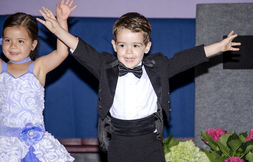 AJ Athridge poses during Stage Door Preschool'   s performance at the Giving Sarasota a Healthy Start luncheon.