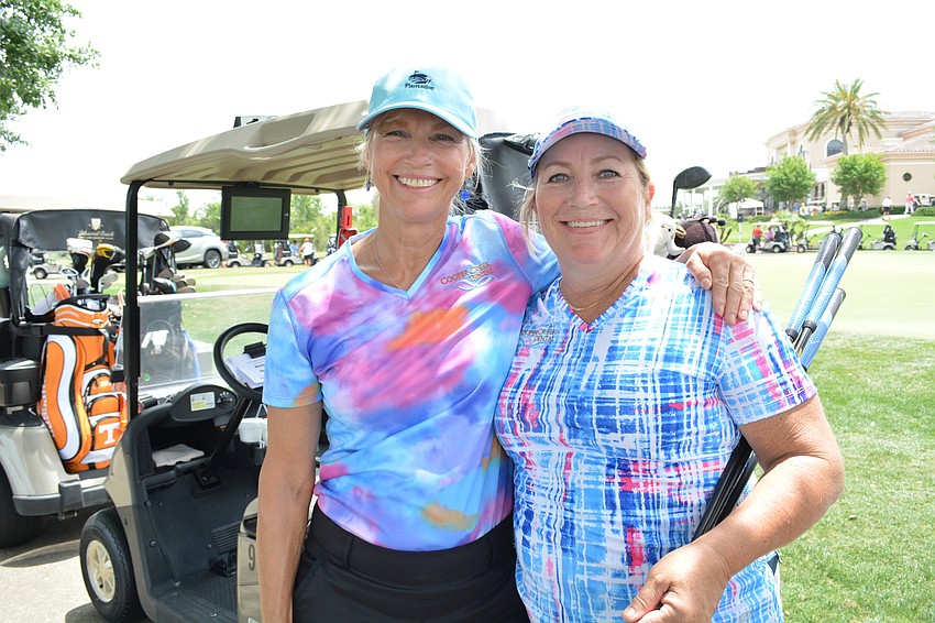 Diane Hennessy, of Cooper Creek Dental, plays in the Ranch Scramble for the first time, with outing veteran Dee Donegan, also of Cooper Creek Dental.