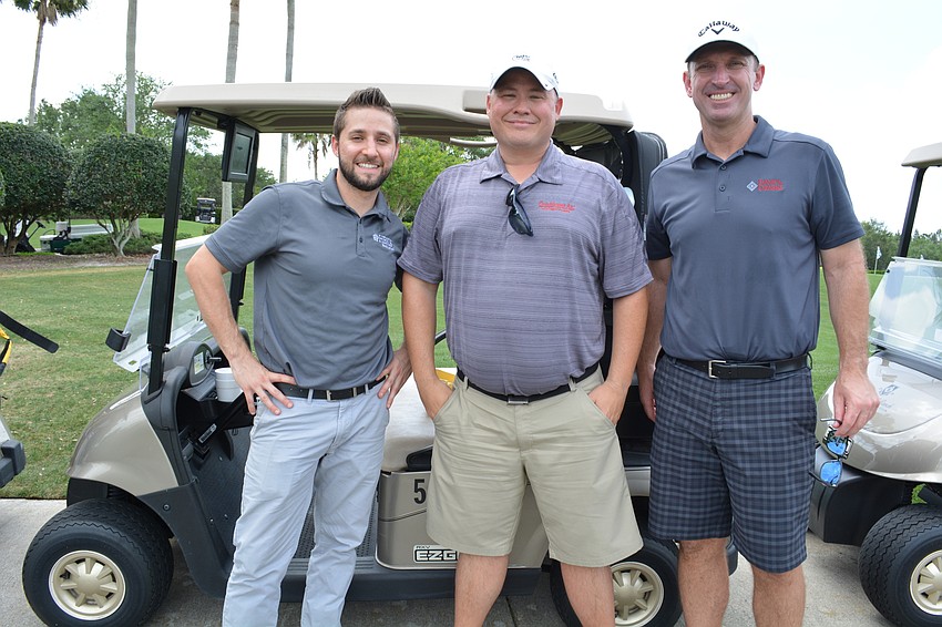 C.J. Morris, of HBKS Wealth Advisors, plays with Conditioned Air'    s Tim Jones and Bank of the Ozarks'     Set Wiepking.