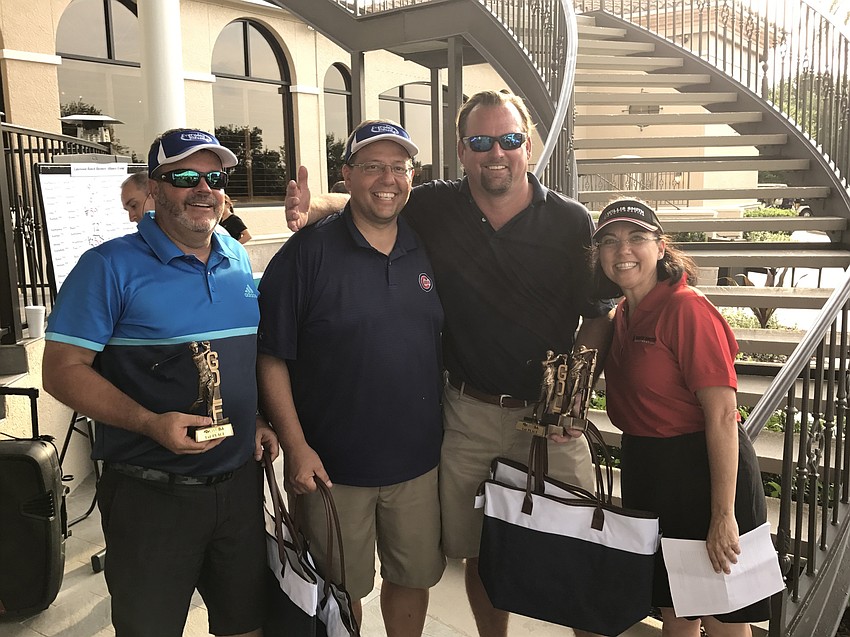 The winning team was Steve Mansfield, Loren Paul, Larry Waterman and Rich Stroud (not pictured). They pose with Alliance Chairwoman Lori Ruth. Photo courtesy of Dan Sidler.