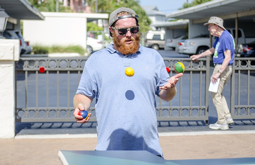 Travis Veckwith of Alpine Frosted Lemonade juggles during the Siesta Fiesta.