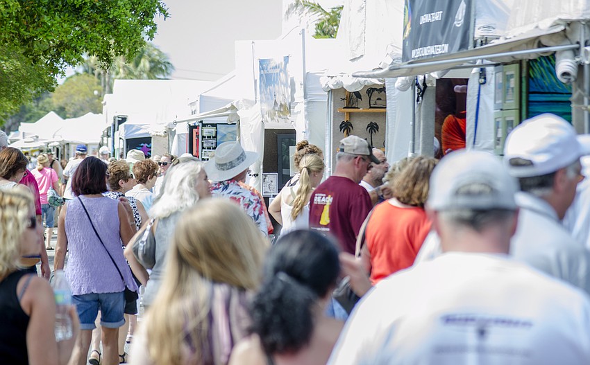 White tents lined Beach Road and Ocean Boulevard through Siesta Key Village.