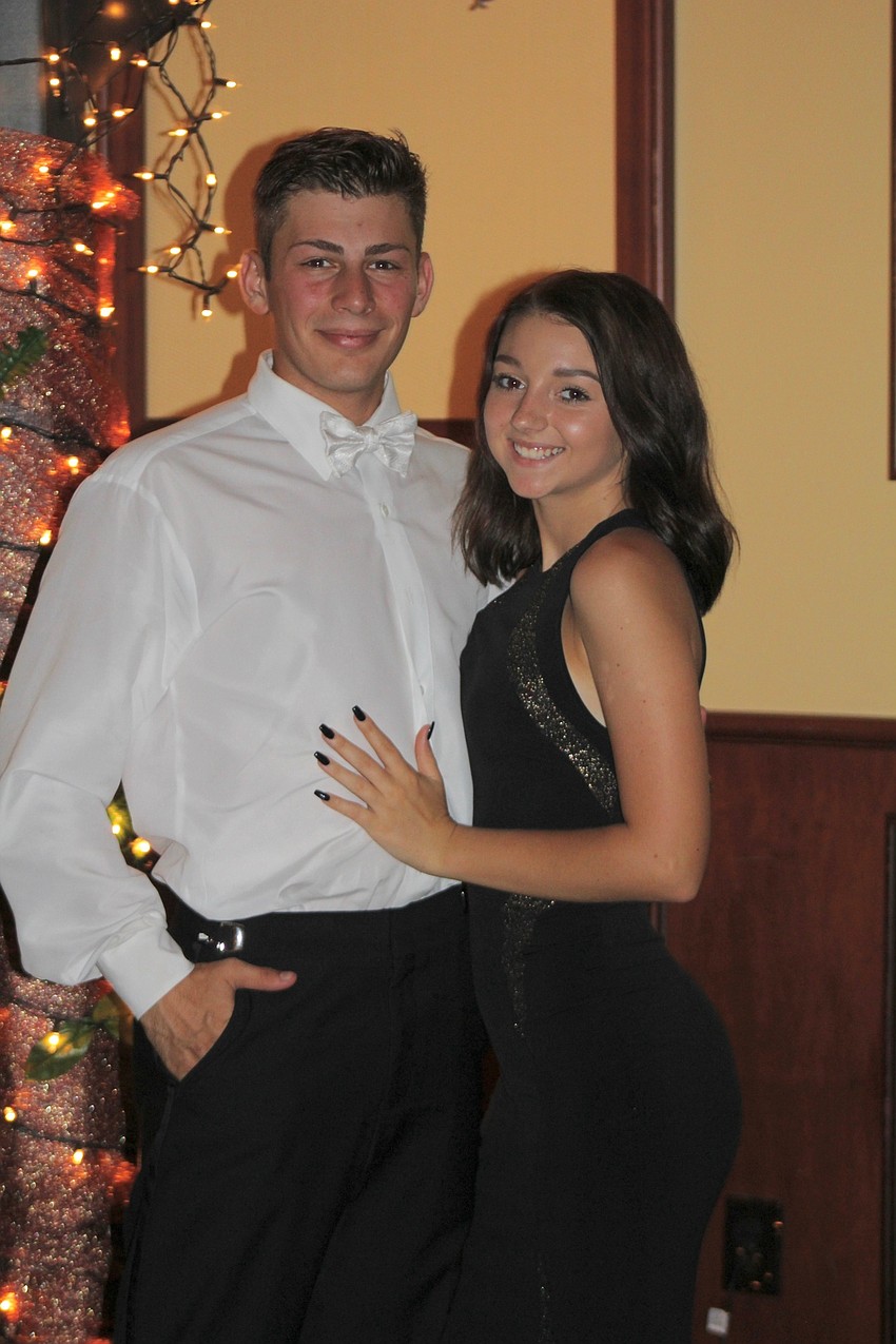 Braden River High School senior Jacob Andrews and sophomore Gabby Reinke snuggle up at prom.